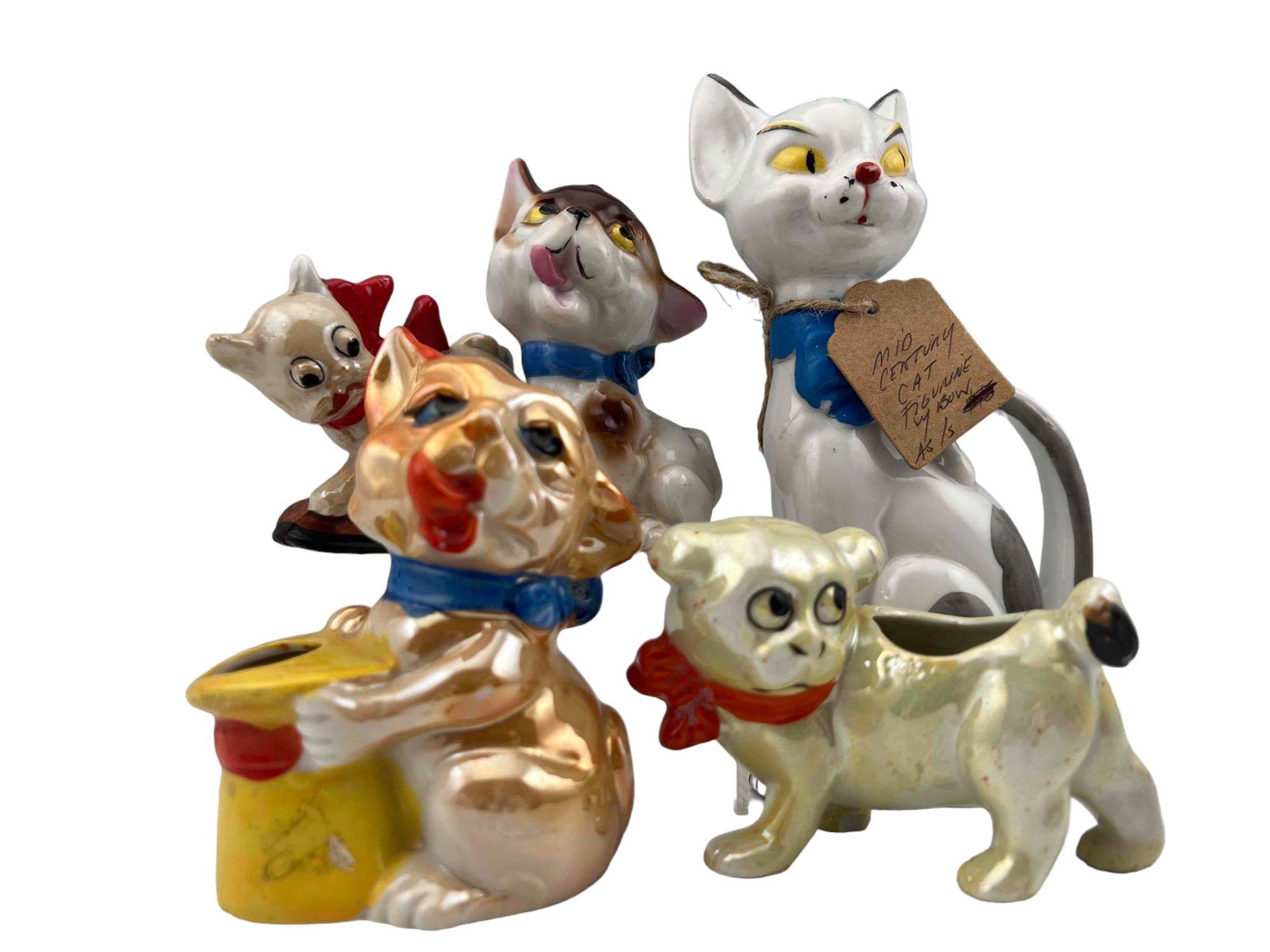 Lot Of Vintage Porcelain Cat Figures: Lot Of Vintage Porcelain Cat Figures. Marked Made in Japan, Japan. Largest Approximately 7.25H x 3.25W x 2.0D in. Smallest Approximately 3.25H x 2.5W x 1.125D in.