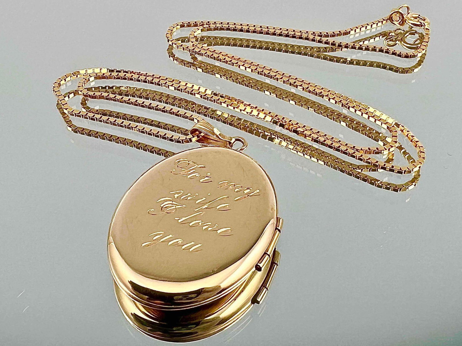 14K Locket Necklace: 14K Locket Necklace, 8.6g. Marked 14K Italy, 585. Locket Inscribed "To my wife I love you." Locket Approximately 1.25L x 0.875W in. Chain Approximately 16.125L in. ALL CREDIT CARDS WILL BE MANUALLY VE