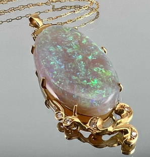 18K Opal Diamond Necklace: 18K Opal Diamond Necklace, 8.1g. Marked 750. Receipt Marked: "Curtis Jewelers Opal Guarantee... Opal type: Crystal, Carat Weight 20.68ct." Pendant Approximately 2.0L x 0.875W in. Opal Approximately 1.