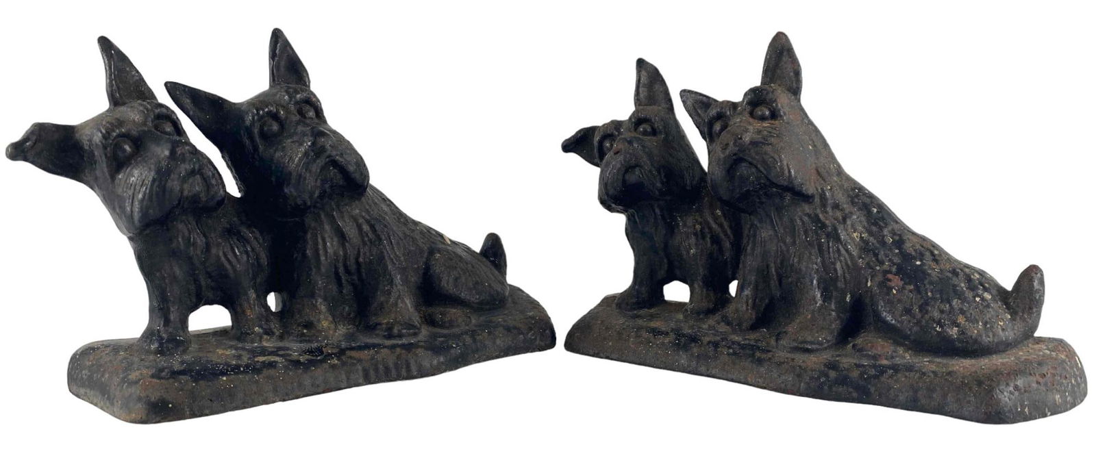 Pair Of Cast Iron Scottie Dog Doorstops: Pair Of Cast Iron Scottie Dog Doorstops. Approximately 5.875H x 8.75W x 2.875D in.