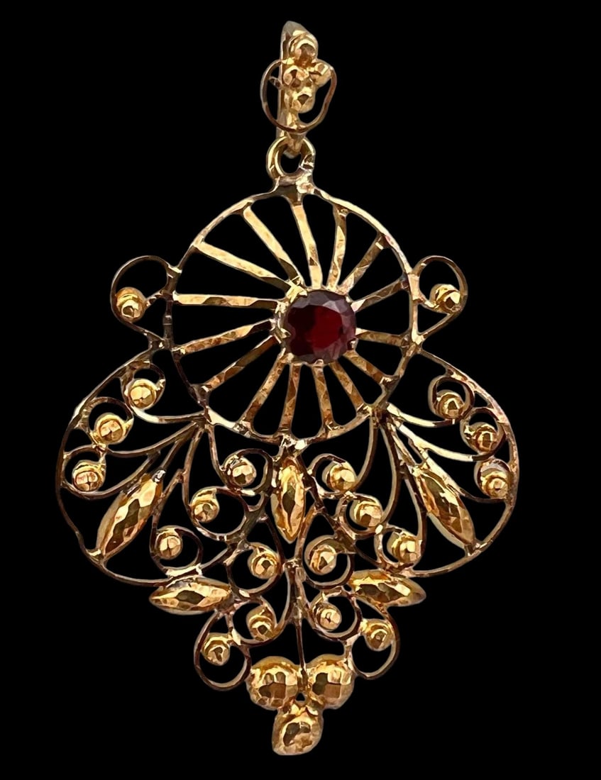 18K Garnet Filigree Pendant: 18K Garnet Filigree Pendant, 4.9g. Unmarked, Tests as 18K. 1.75L x 1.3125W measurements are approximate. ALL CREDIT CARDS WILL BE MANUALLY VERIFIED PRIOR TO SHIPMENT.