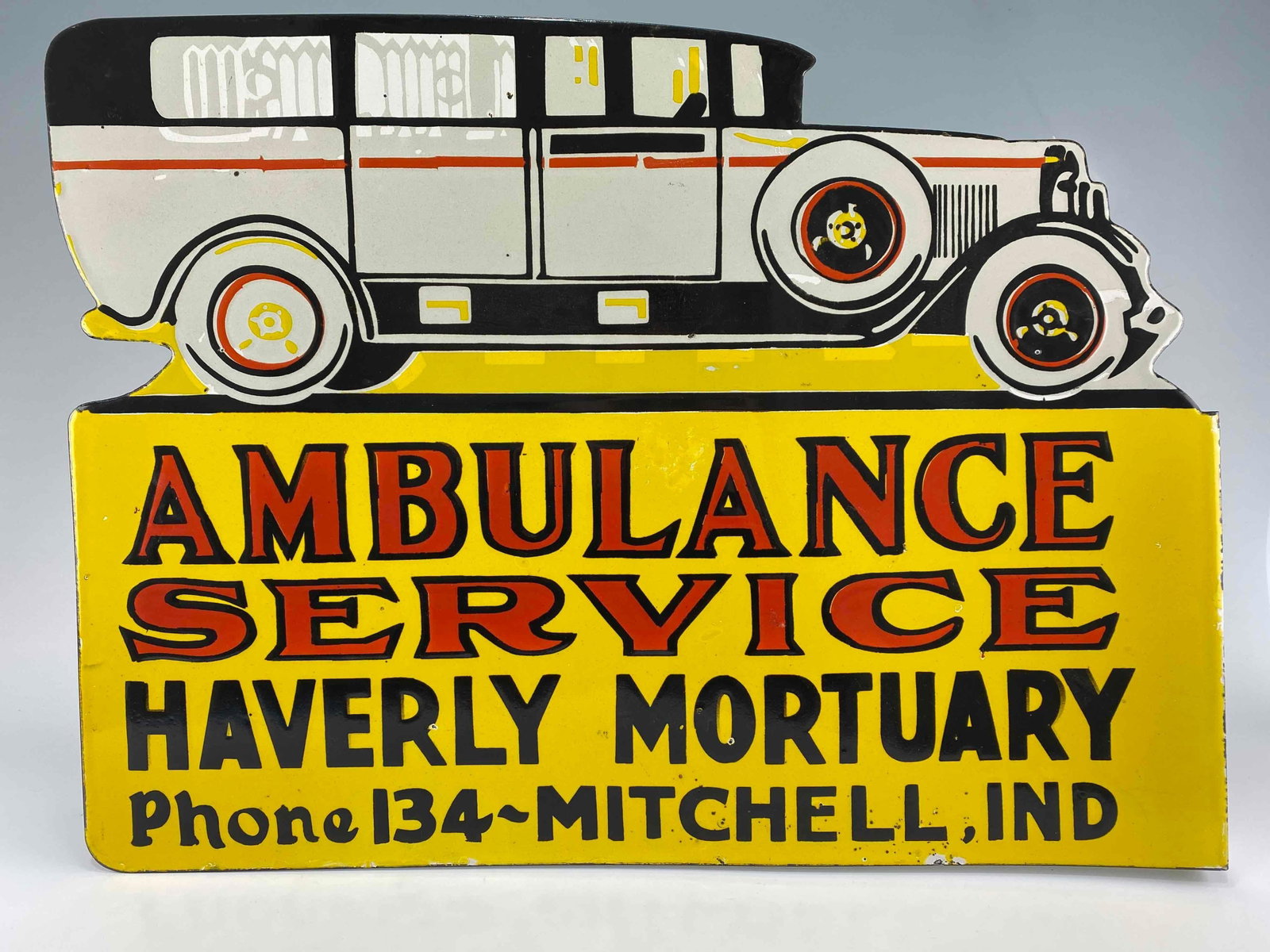 Large Haverly Mortuary Porcelain Sign: Large Haverly Mortuary Porcelain Sign. Reads "Ambulance Service Haverly Mortuary Phone 134- Mitchell Ind." Approximately 24.5L x 17.875H x 3.0D in.