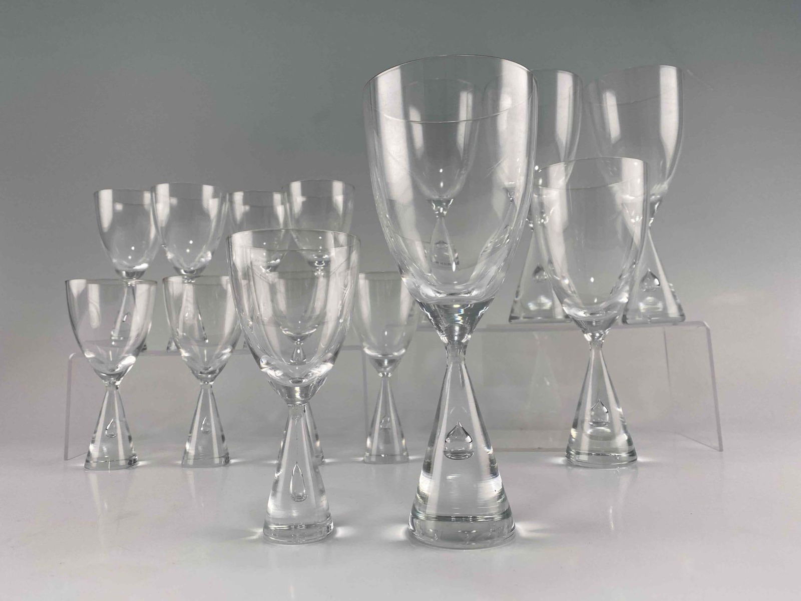 Bent Severin for Holmegaard, "Princess" Glass Stemware, Mid Century Modern Danish Glasses: Bent Severin for Holmegaard, "Princess" Glass Stemware, Mid Century Modern Danish Glasses. Lot includes eight smaller glasses, and five larger glasses. Larger glasses 8.25H x 3.375W in. Smaller Glasse