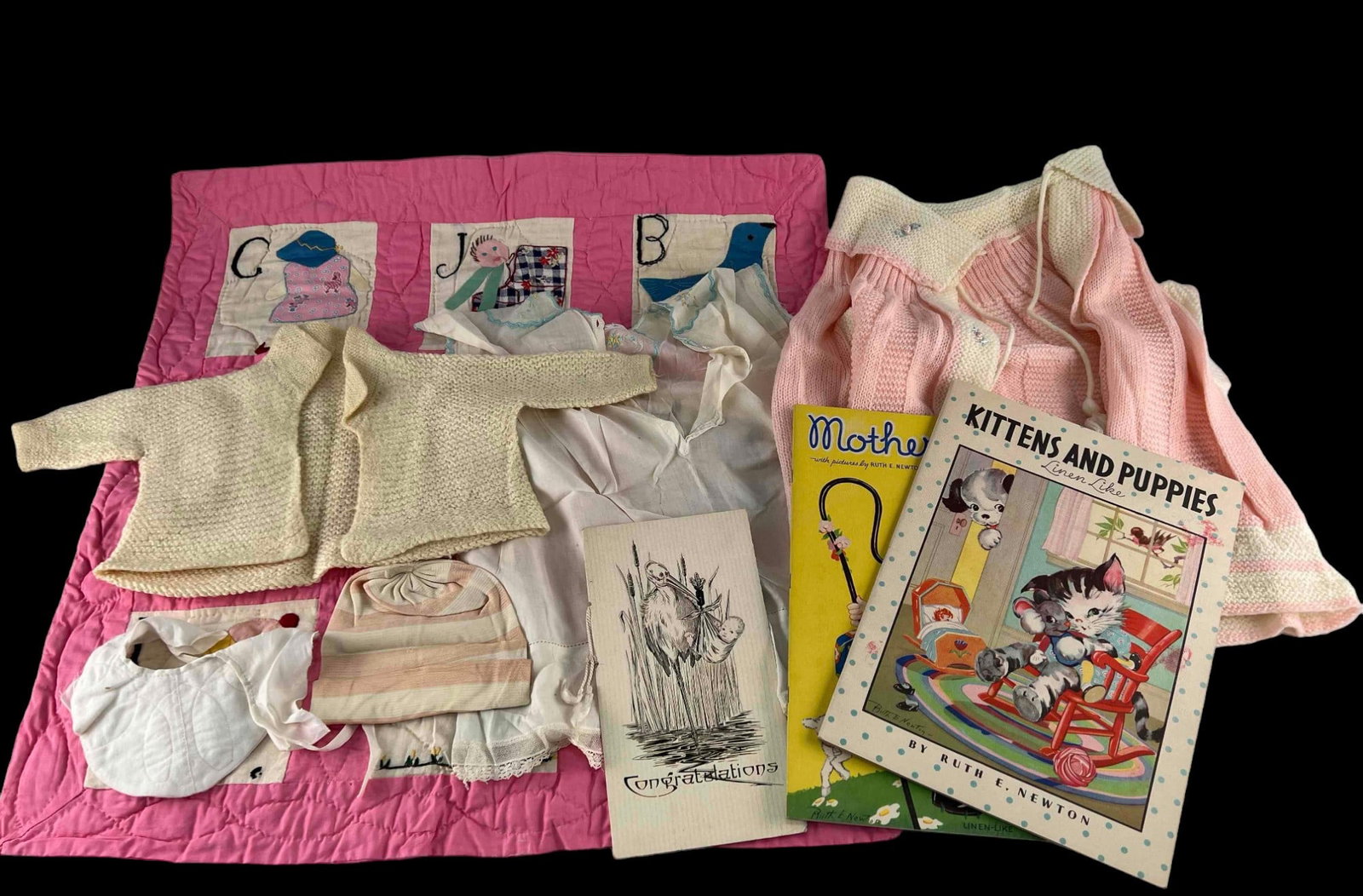 Vintage Baby Clothes, Quilt, and Books: Vintage Baby Clothes, Quilt, and Books. Largest Item (Blanket) 24.75H x 24.0W in. Smallest Item (Hat) 5.5H x 12.0Rim in. All Measurements are Approximate.