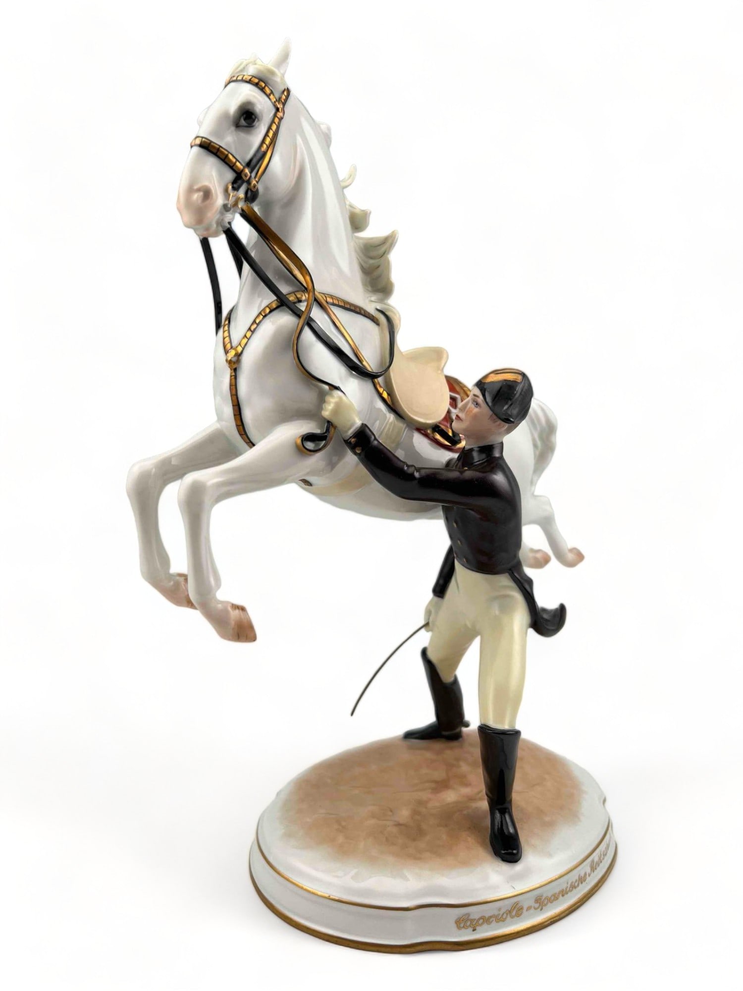 Augarten Vienna Porcelain Spanish Horse Riding School Figure: Augarten Vienna Porcelain Spanish Horse Riding School Figure. Titled, "Capciole-Spanische Reitschule, Hofburg Wien." Please note that this piece is missing part of stirrup, as shown in photos. Approxi