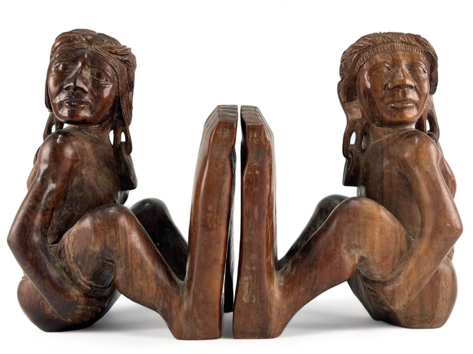 Hand Carved Figural Native American Wooden Bookends: Hand Carved Figural Native American Wooden Bookends, . Each Approximately 6.75H x 5.375W x 4.75D in.
