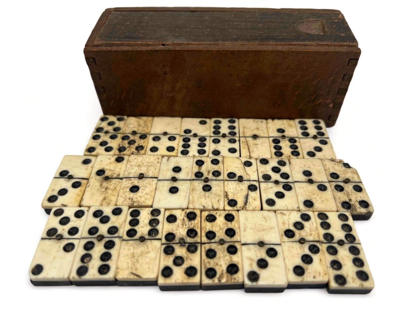Antique Ebony Dominoes: Antique Ebony Dominoes. 25 pieces. Box 5.75L x 2.125H x 1.9375W in. Dominos 1.4375H x 0.6875W x 0.25D in. All Measurements are Approximate.