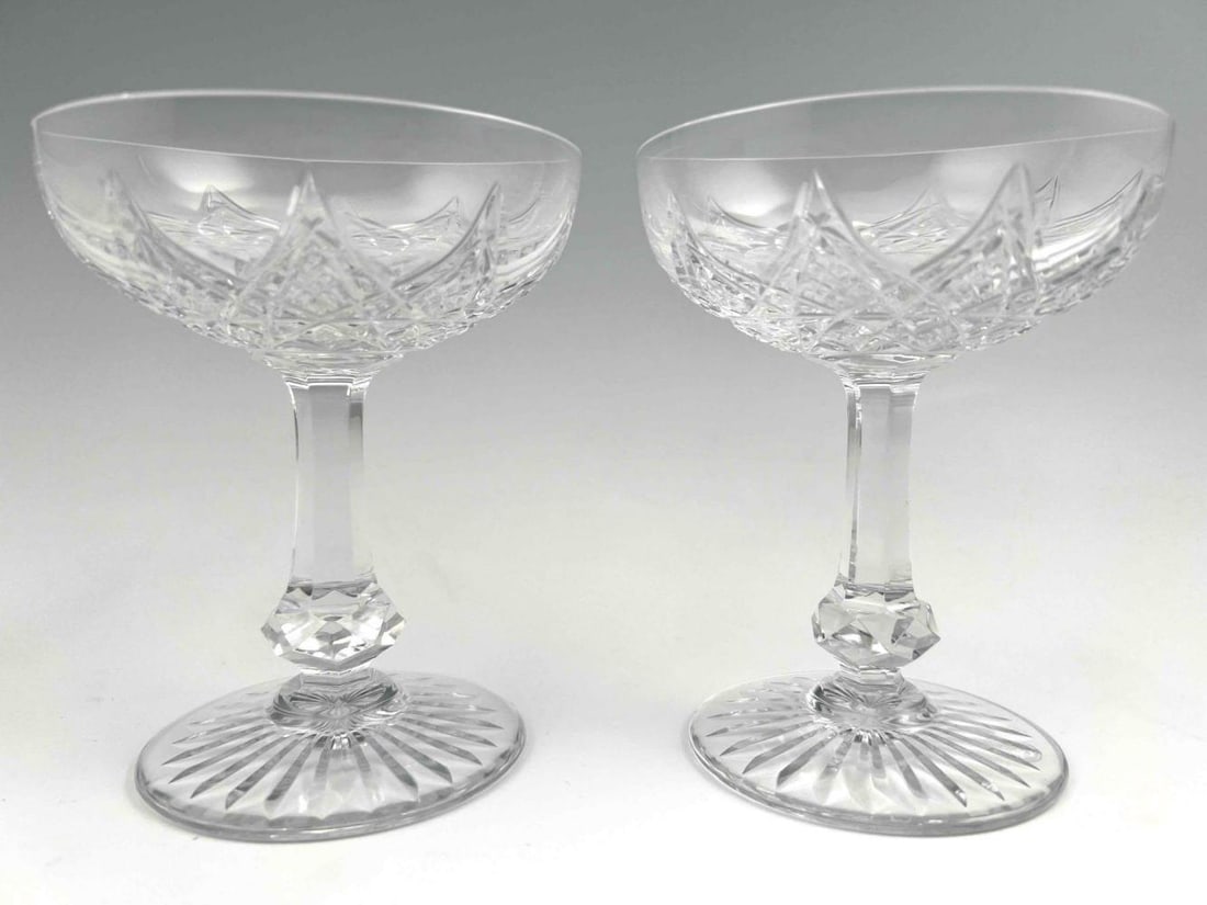 Pair Of Baccarat Cut Crystal Champagne Glasses: Pair Of Baccarat Cut Crystal Champagne Glasses. Marked "Baccarat France." Each approximately 4.75H x 3.875W in.