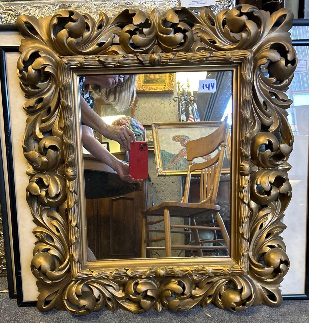 Ornate Gilt Wood Mirror: Ornate Gilt Wood Mirror. Approximately 25.0H x 22.0W x 2.0D in.