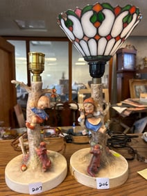 Pair Of Hummel Porcelain Table Lamos, One With Stained Glass Shade