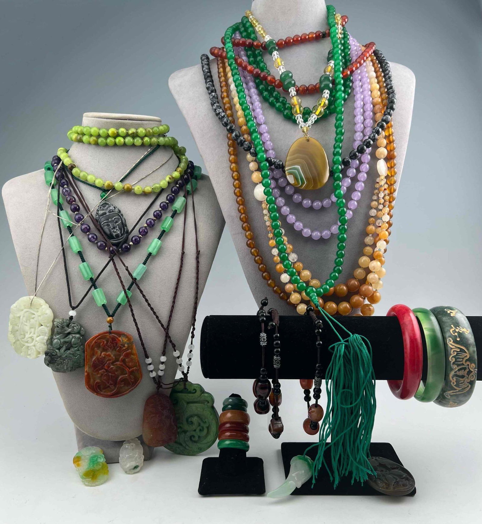 Grouping Of Beaded & Asian Jewelry: Grouping Of Beaded & Asian Jewelry. Includes Bracelets, beads, pendants, rings, and more. Longest bead strand approximately 20.0in. Approximate ring sizes 7 and 10.