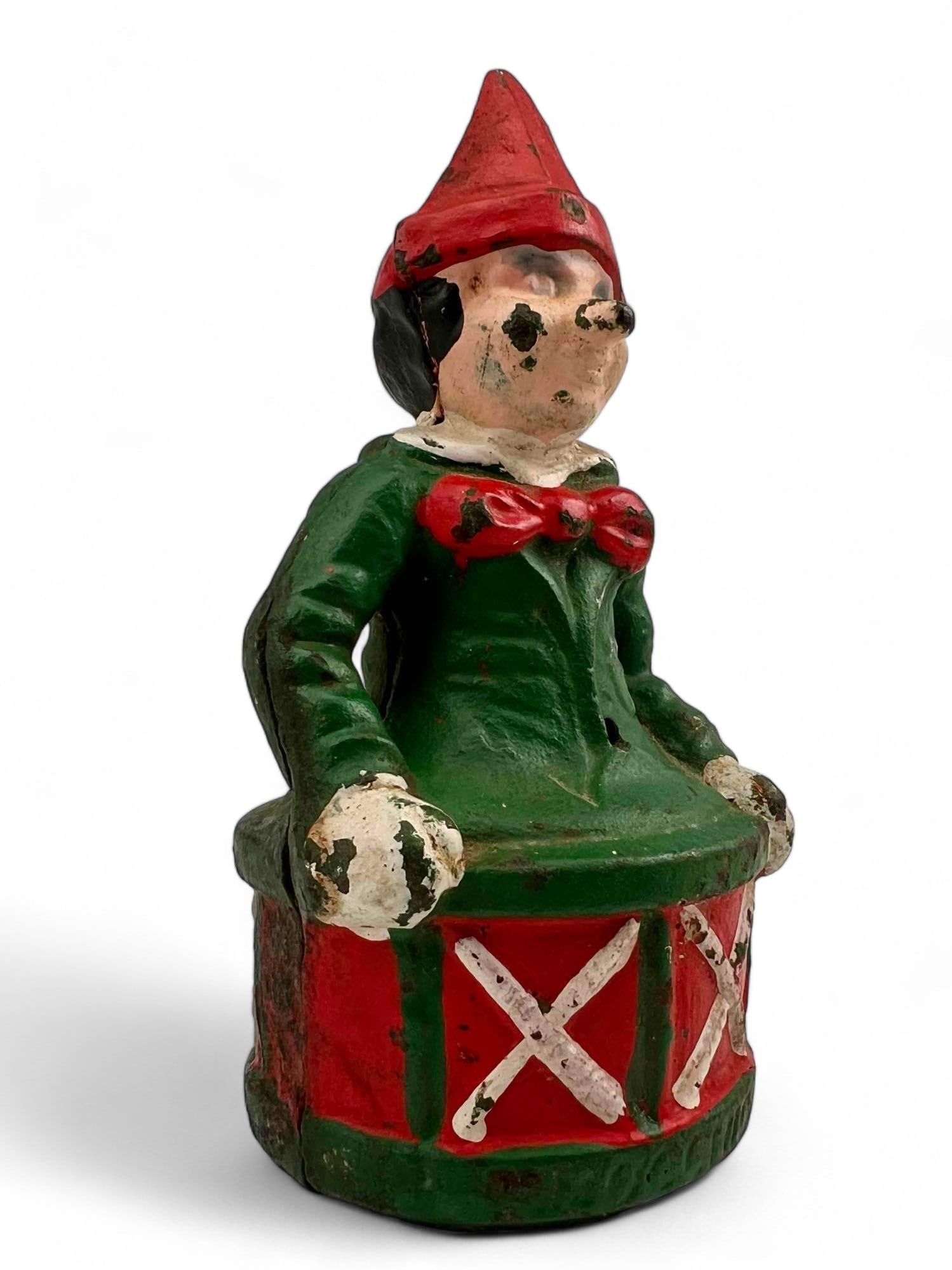 Antique Cast Iron Pinocchio Bank: Antique Cast Iron Pinocchio Bank. Approximately 5.625H x 3.0W x 2.875D in.