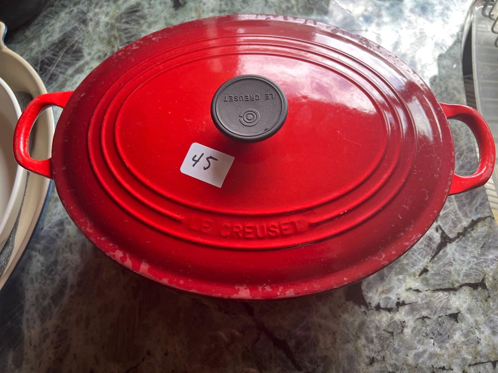 Le Creuset Red Enamel Cast Iron Dutch Oven: Le Creuset Red Enamel Cast Iron Dutch Oven. Approximately 15.5L x 10.5W x 6.5H in SHIPPING AVAILABLE FOR THIS LOT THOUGH LISTED SHIPPERS Pick-Up will be Thursday Aug 8th & Saturday Aug 10th from 11:00