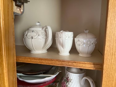 Cupboard With Tea Set, Serving Plates, And More