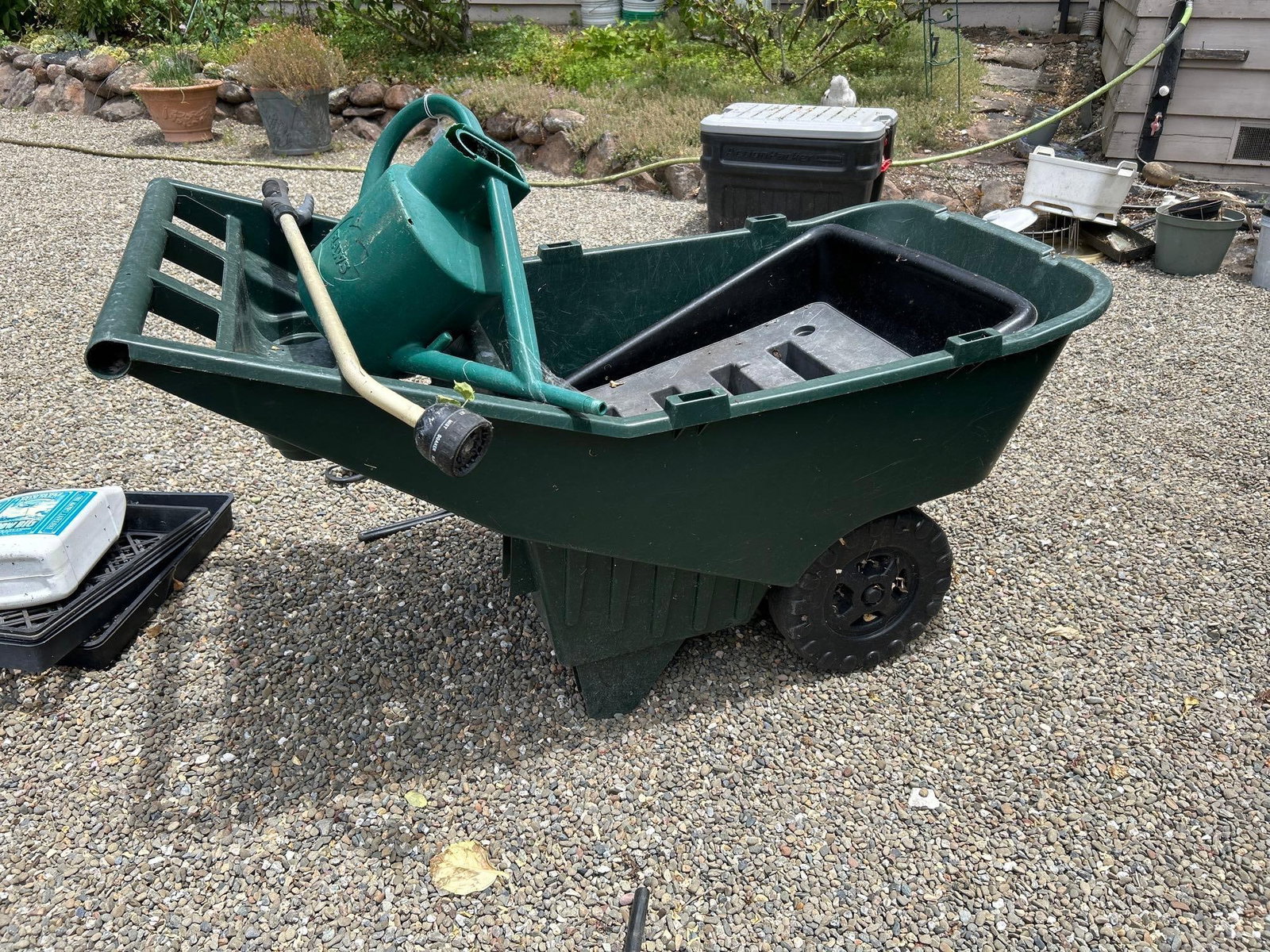 Wheel Barrow, Watering Can, And Hose Attachment: Wheel Barrow, Watering Can, And Hose Attachment Pick-Up will be Thursday Aug 8th & Saturday Aug 10th from 11:00-4:00. Shipped items must have shipping arranged by Saturday, Aug 10th. Items not picked 