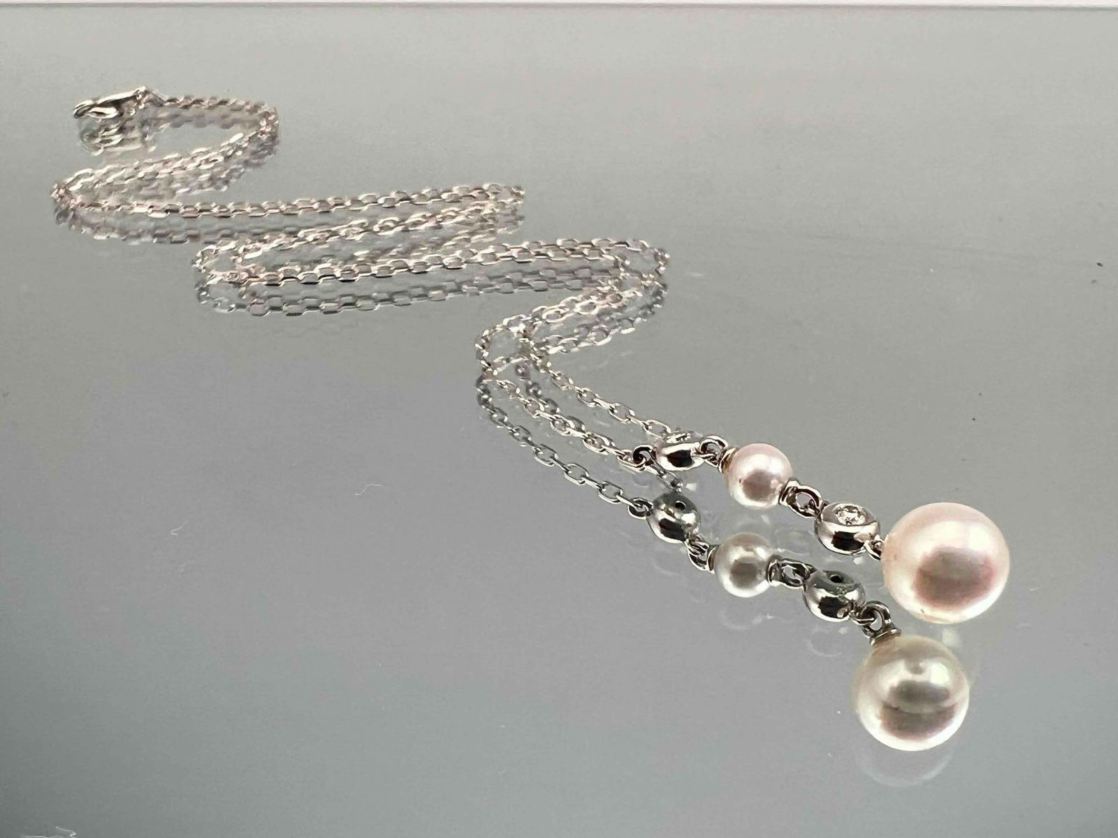 Mikimoto 18K Diamond & Pearl Necklace: Mikimoto 18K Diamond & Pearl Necklace, 3.1g. Marked 18K, Signed M. Chain length 18.25in. Pendant 1.0in long. Largest pearl 6.5mm. All measurements are approximate. ALL CREDIT CARDS WILL BE MANUALLY VE