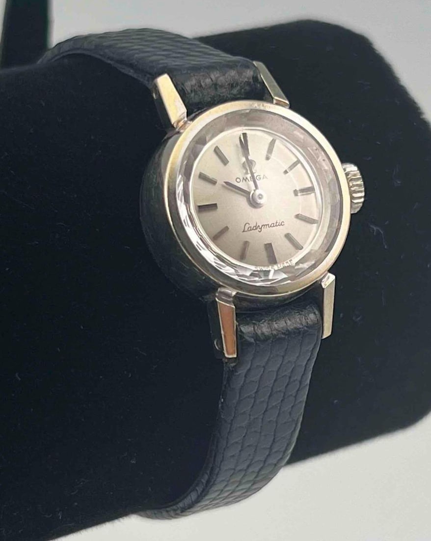 Vintage Omega 14K Ladies Wrist Watch: Vintage Omega 14K Ladies Wrist Watch. Face marked "Omega Ladymatic Swiss Made." Reverse marked "14K Gold." Face 0.625in. Maximum inner circumference 7.5in. ALL CREDIT CARDS WILL BE MANUALLY VERIFIED P