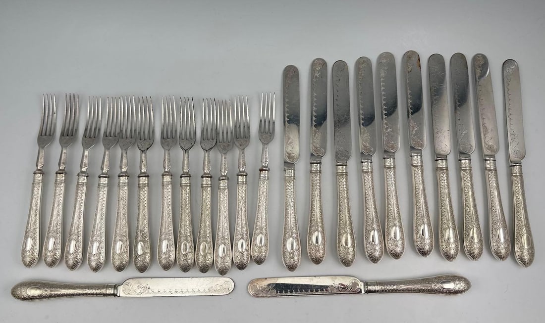 Antique Etched Silver Plate Flatware: Antique Etched Silver Plate Flatware. Includes 12 forks, 12 knives. Forks approximately 7.25L x 0.75W in