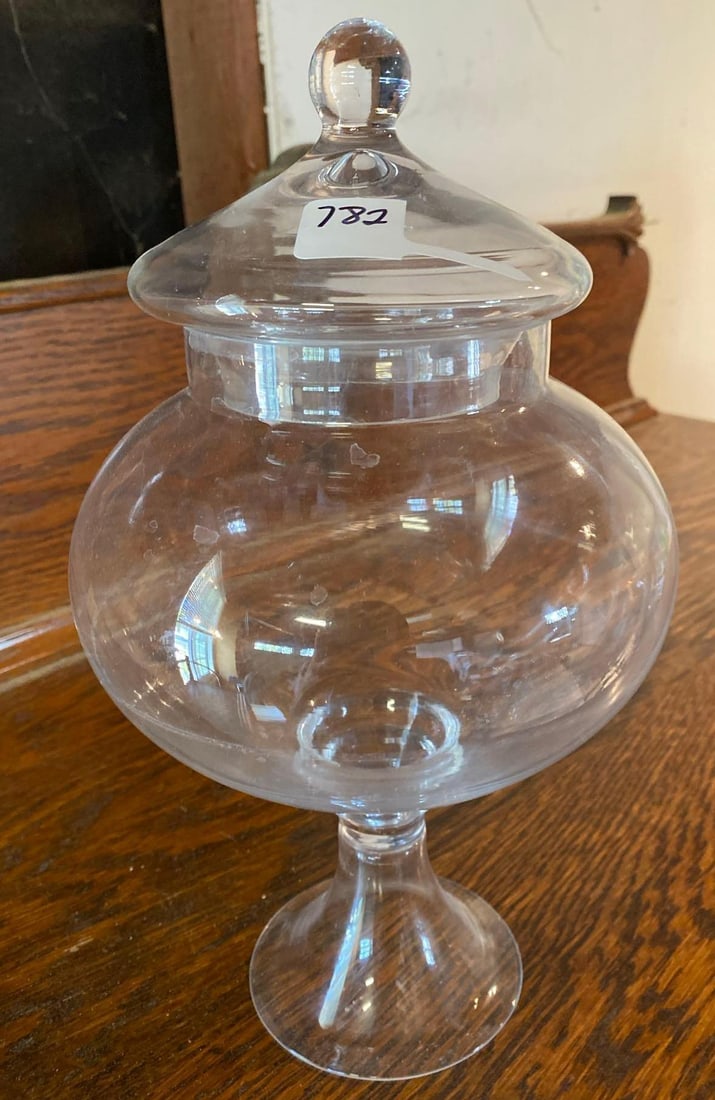 Lidded Glass Apothecary Jar: Lidded glass apothecary jar. Approximately 11.0 H6.0 W inches. Shipping available for this lot