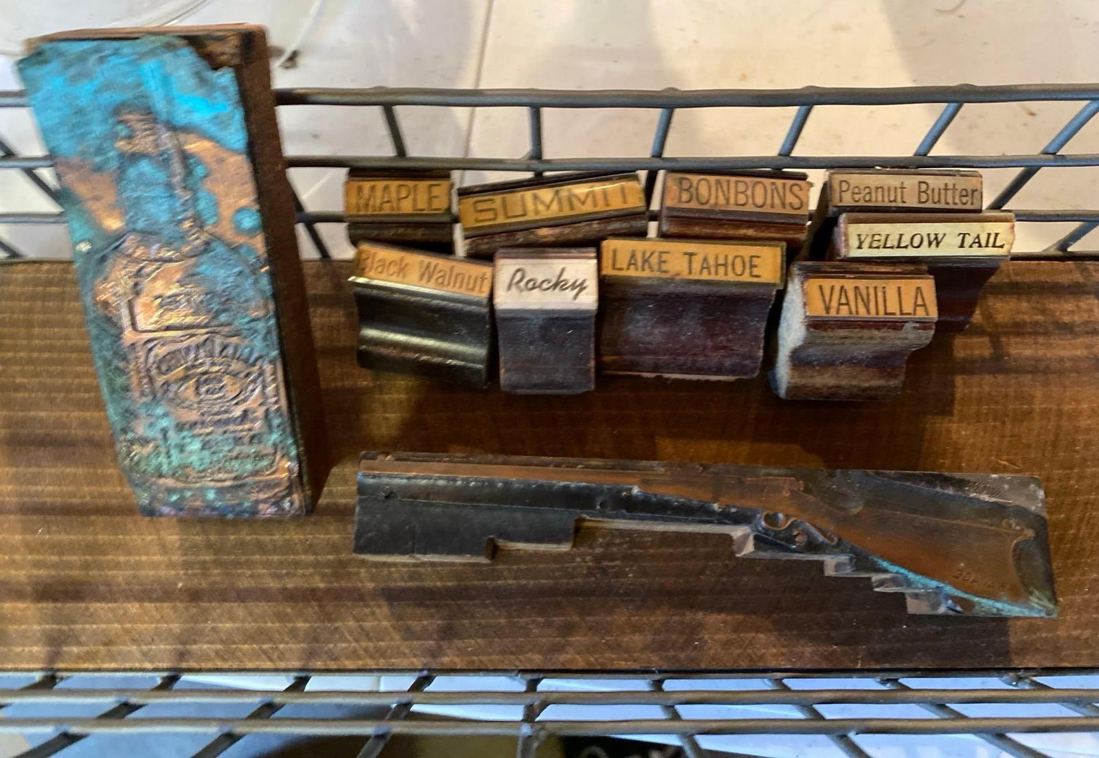 Vintage Stamps In Metal Basket: Vintage stamps in metal basket. Stamps include rifle, lake Tahoe, Summit, bonbons, yellowtail, and more.
