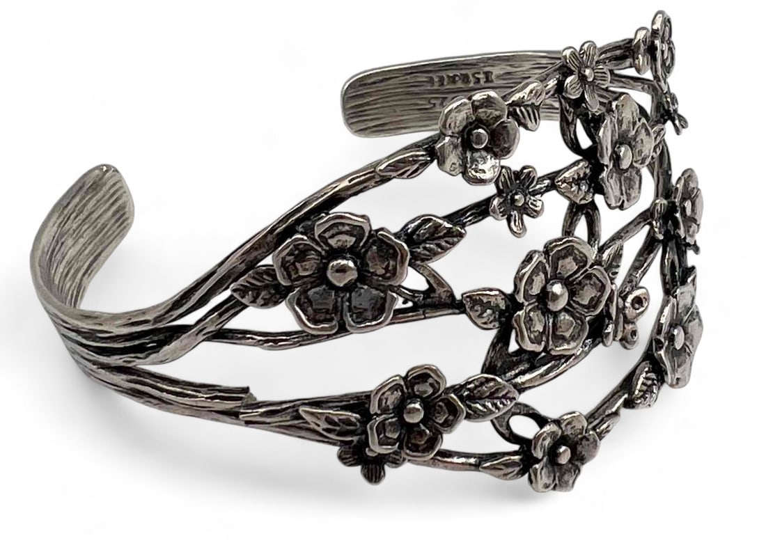 Sterling Silver Blossom Motif Cuff Bracelet: Sterling Silver Blossom Motif Cuff Bracelet, 26.9g. Marked "PZ 925 Israel." Width at front approximately 1.5in. Inner cuff approximately 6.0in. Cuff break approximately 1.0 in.