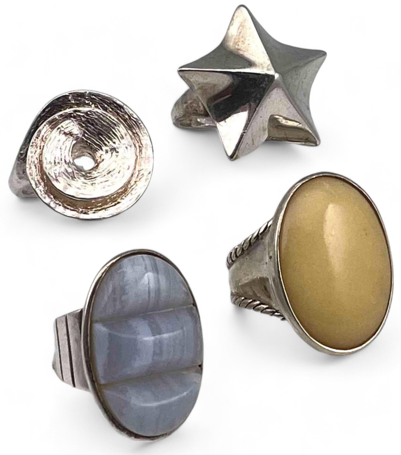 Four Sterling Silver Rings: Four Sterling Silver Rings, 43.2g. Marked 925. Approximate ring sizes 7, 8, 9, and 9.