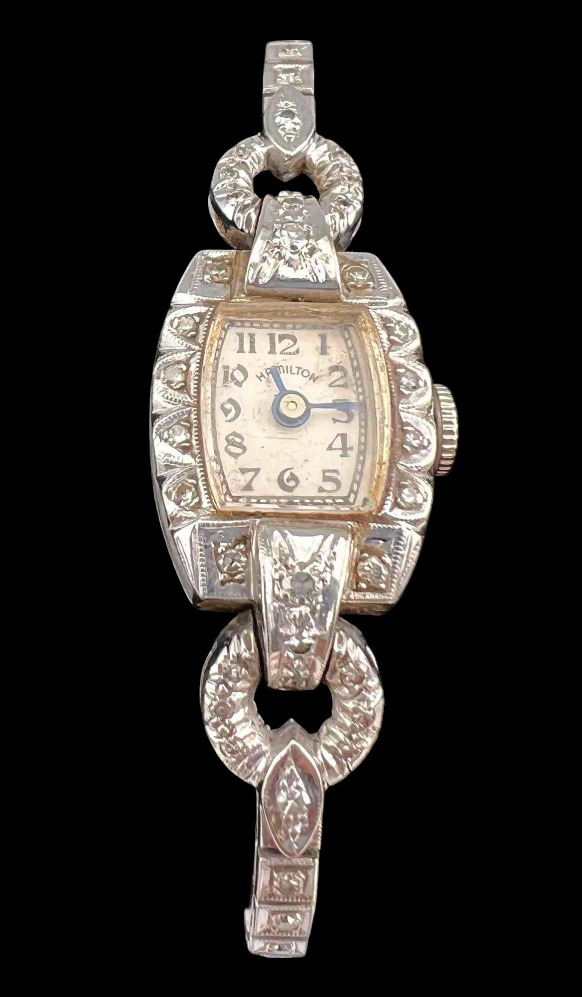 Art Deco &14K Diamond Ladies Watch: Art Deco &14K Diamond Hamilton Ladies Watch. 15.8g total weight. Band and watch marked 14k. Not running. Watch approximately 1.125L x 0.5W in. Watch face approximately 0.4125L x 0.375W in. Inner circu