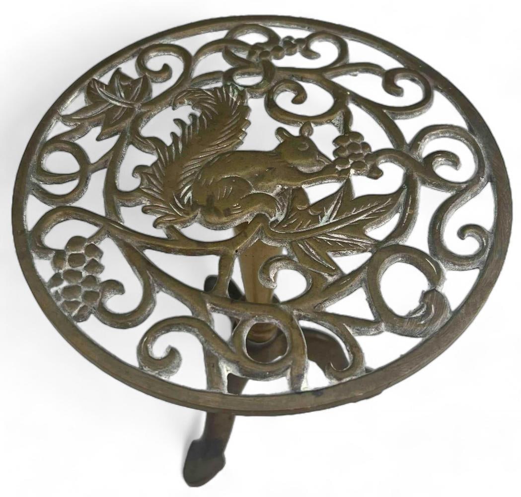 Antique Brass Trivet Table With Squirrel Motif: Antique Brass Trivet Table With Squirrel Motif. Approximately 8.0H x 7.75W x 7.75D in.
