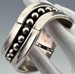 Vintage Mexican Sterling Silver Modernist Bracelet: Vintage Mexican Sterling Silver Modernist Bracelet, 56.2g. Marked "925 Mexico". Inner circumference 7.0in., Width 1.25in. All measurements are approximate.