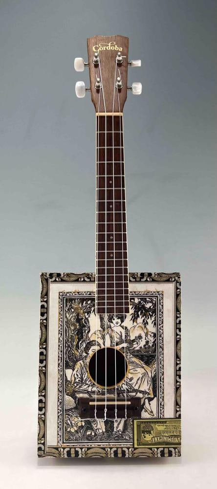 Cordoba Cigar Box Ukelele: Cordoba Cigar Box Ukelele. Approximately 22.25H x 7.5W x 2.5D in.