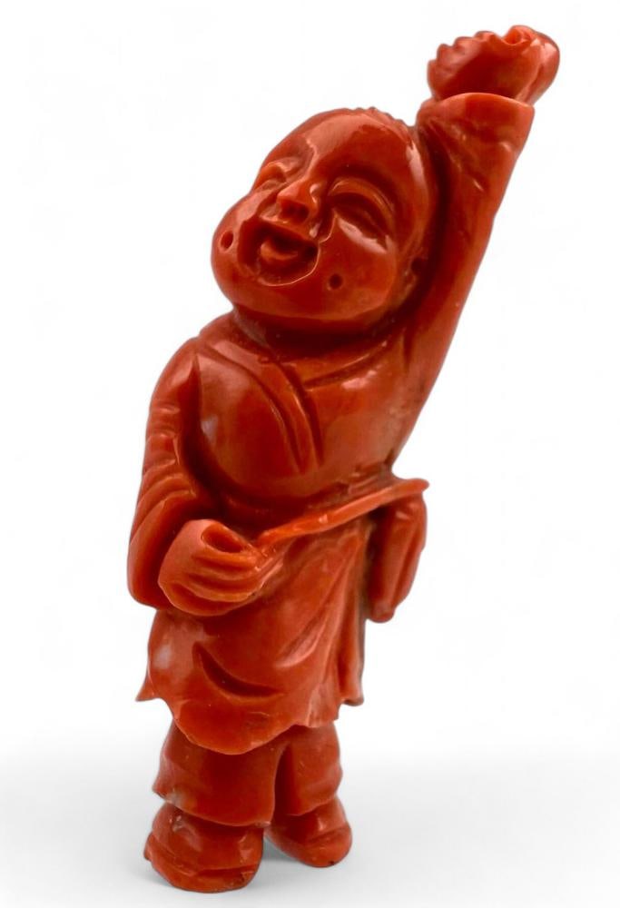 Chinese Carved Red Coral Figure: Chinese Carved Red Coral Figure. Approximately 2.125H x 0.75W x 0.375D in.
