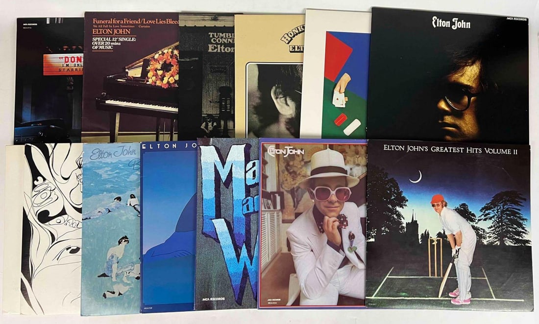 Thirteen Elton John Vinyl LP's: Thirteen Elton John Vinyl LP's. Includes: Elton John, MCA Records, MCA-37067, Ca. 1980; Madman Across The Water, MCA Records, Ca. 1980, MCA-37200; Elton John And Leon Rusel (Two Records) Live at Anahe