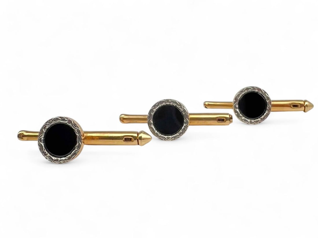 Set Of 14K Onyx Shirt Studs: Set Of 14K Onyx Shirt Studs, 2.8g. Marked 14K. Each approximately 0.875L x 0.25W in. ALL CREDIT CARDS WILL BE MANUALLY VERIFIED PRIOR TO SHIPMENT.