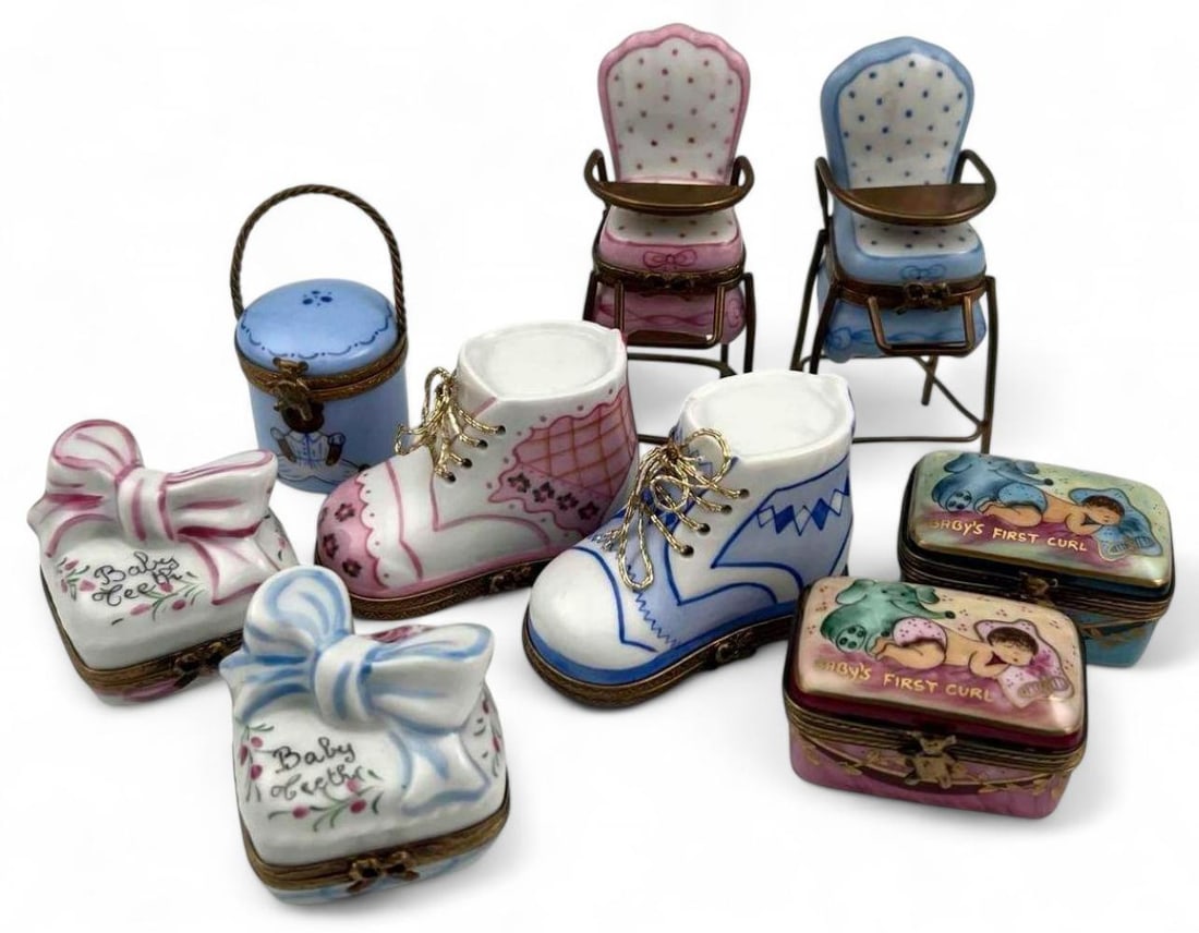 Nine Limoges Hand Painted Porcelain Baby Keepsake Boxes: Nine Limoges Hand Painted Porcelain Baby Keepsake Boxes, Including "Baby Teeth" & "Baby's First Curl." Each marked "Peint Main Limoges France." Largest approximately 3.5H x 1.375W x 1.625D in. Smalles