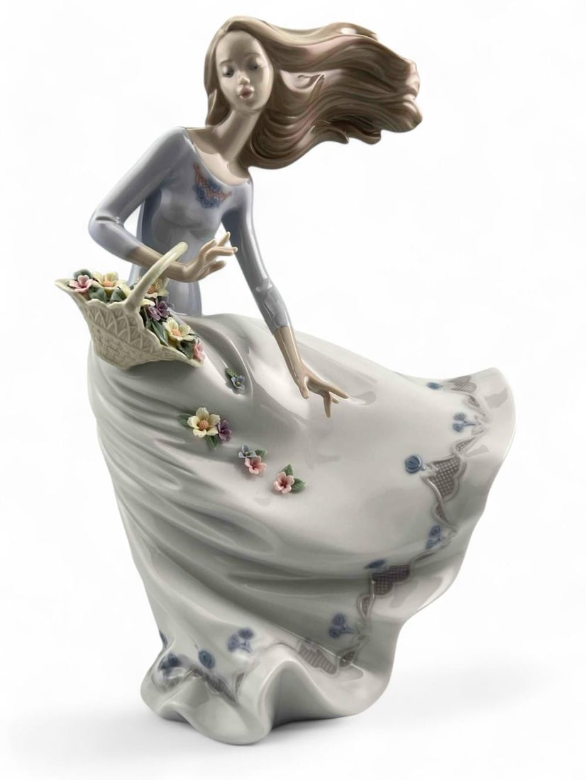 Lladro Petals In The Wind Porcelain Figure, Number 6767: Lladro Petals In The Wind Porcelain Figure, Number 6767. Marked "Lladro Hand Made In Spain N1BJY, Daisa 2000."Approximately 11.875H x 7.5W x 4.75D in.