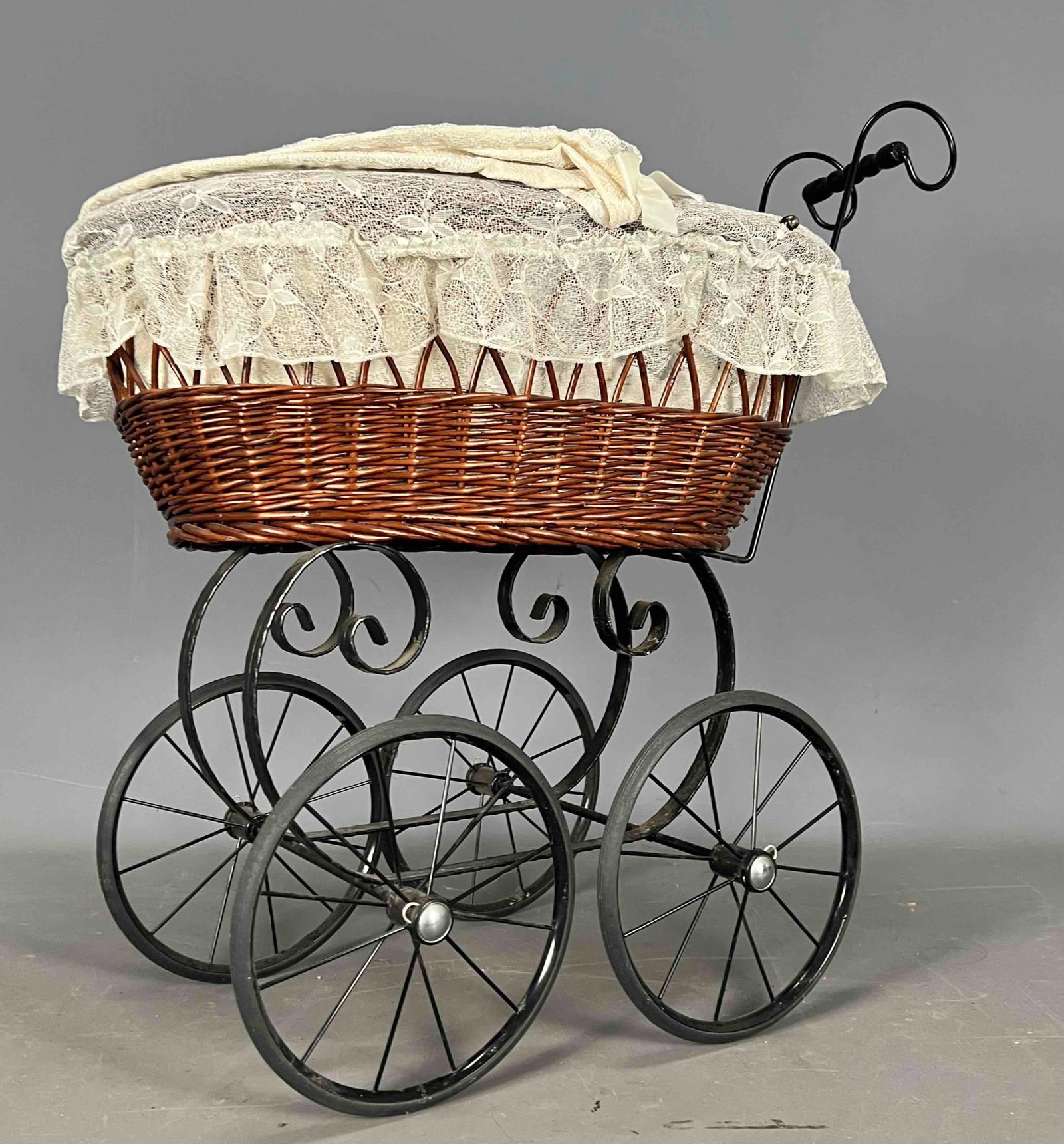 Antique Wicker Pram With Porcelain Head Doll: Antique Wicker Pram With Porcelain Head Doll. Approximately 30.0H x 29.5D x 18.5W in. Doll Approximately 20.5H x 8.0W x 4.0D in.