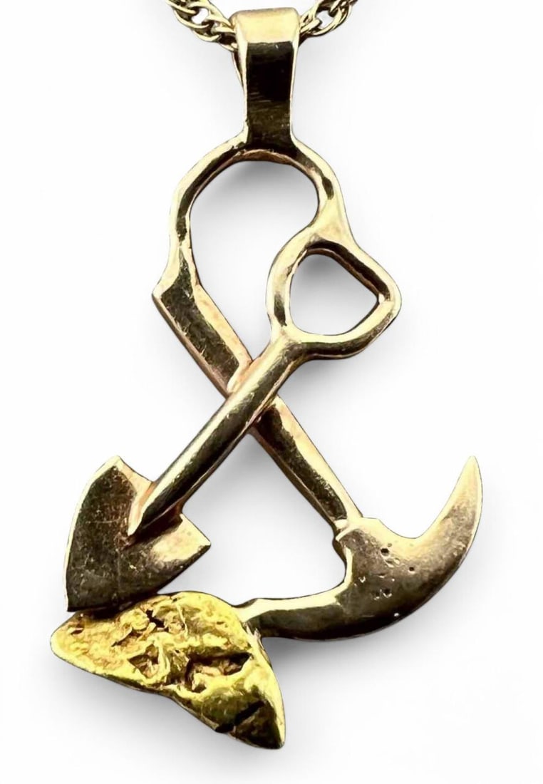 14K Gold Miner Nugget Necklace: 14K Gold Miner Nugget Necklace, 2.2g. Pendant marked 14K. Chain unmarked, tests as 14K. Pendant approximately 0.875L x 0.5W in. Chain length approximately 17.5in. ALL CREDIT CARDS WILL BE MANUALLY VER