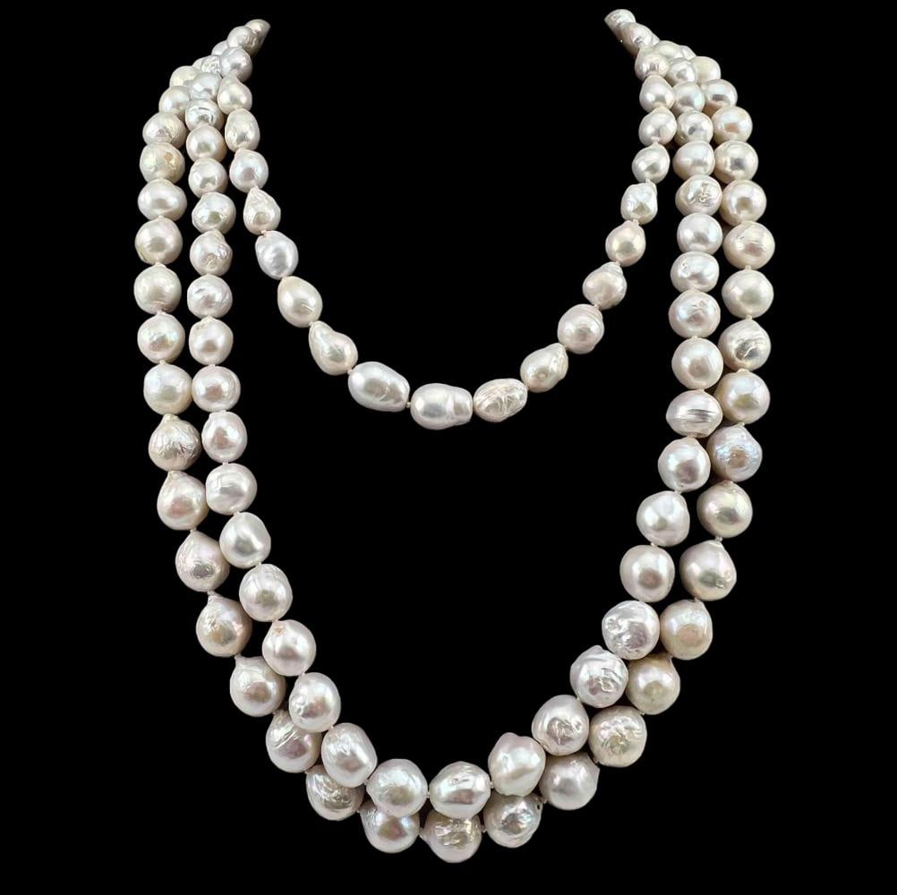 Three Large Baroque Freshwater Pearl Necklaces: Three Large Baroque Freshwater Pearl Necklaces, 365.8g. Two longer strands feature sterling silver clasps, marked 925. Longest strand approximately 29.0in. Pearls approximately 15.3L x 13.4W mm. Short