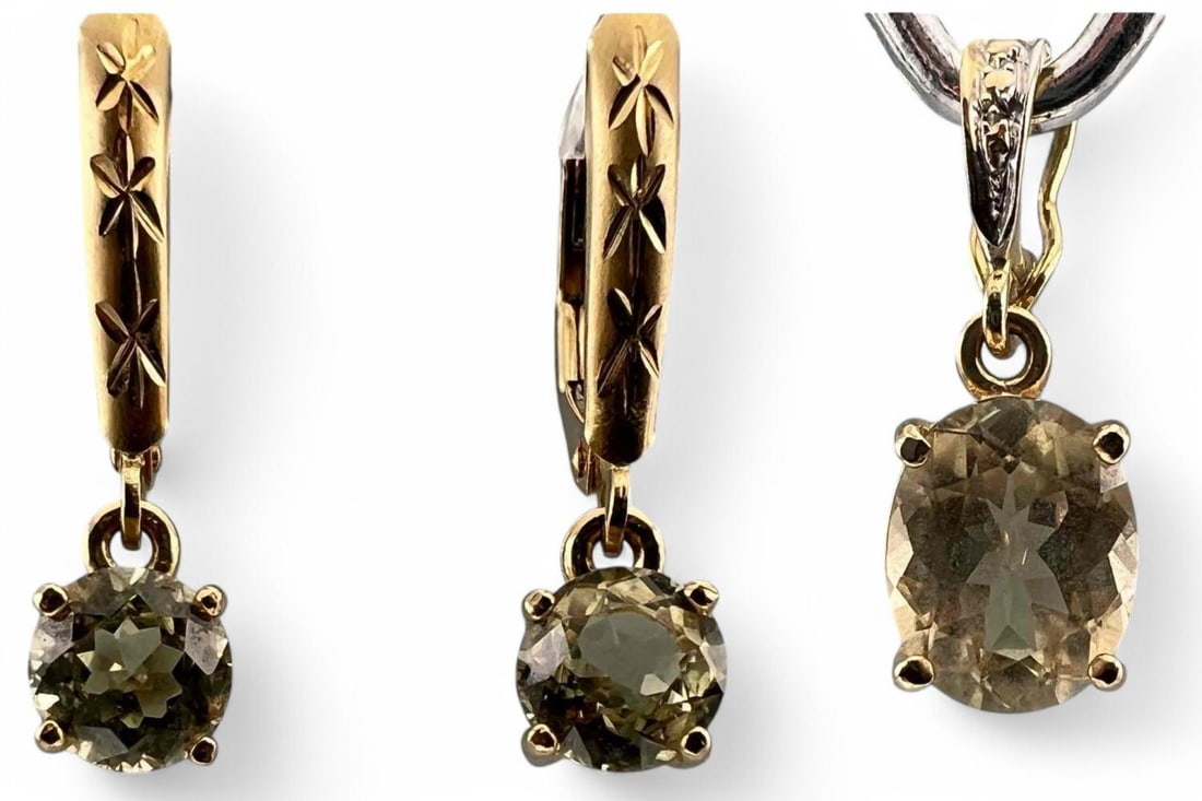14K Topaz Pendant & Earrings: 14K Topaz Pendant & Earrings, 3.8g. Pendant marked 585, Earrings marked 14K. Pendant approximately 0.875L x 0.3125W in. Topaz in pendant 9.1 x 7.2 mm. Topaz in earrings approximately 6.0mm. All measur