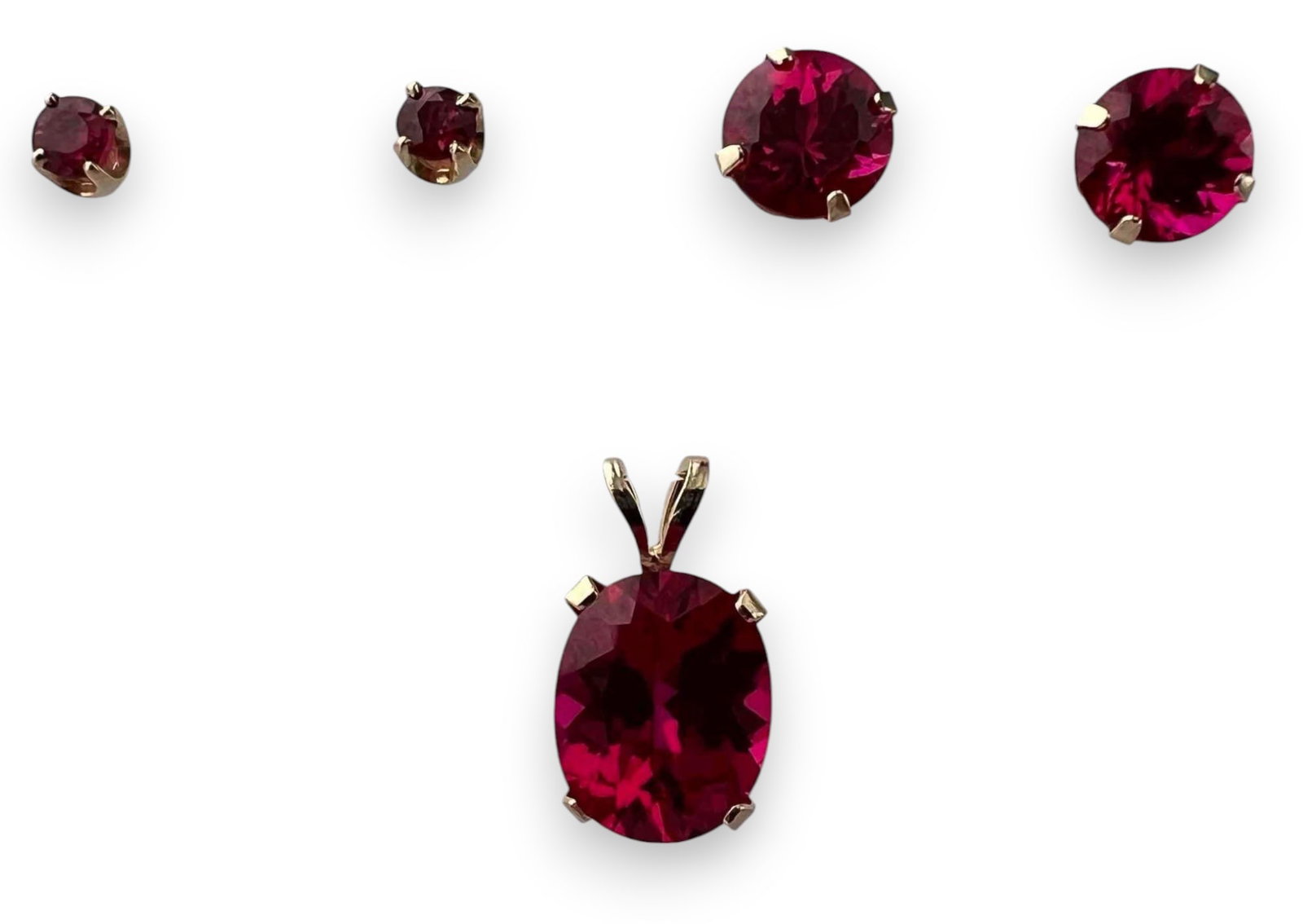 14K Pink Sapphire Pendant & Earrings: 14K Pink Sapphire Pendant & Earrings, 2.8g. Marked 14K. Pendant approximately 10.0 x 6.0mm (excluding bale). Larger earrings 6.5mm. Smaller earrings 3.1mm. All measurements are approximate. ALL CREDIT