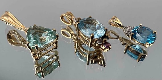 Three 14K Blue Topaz Pendants