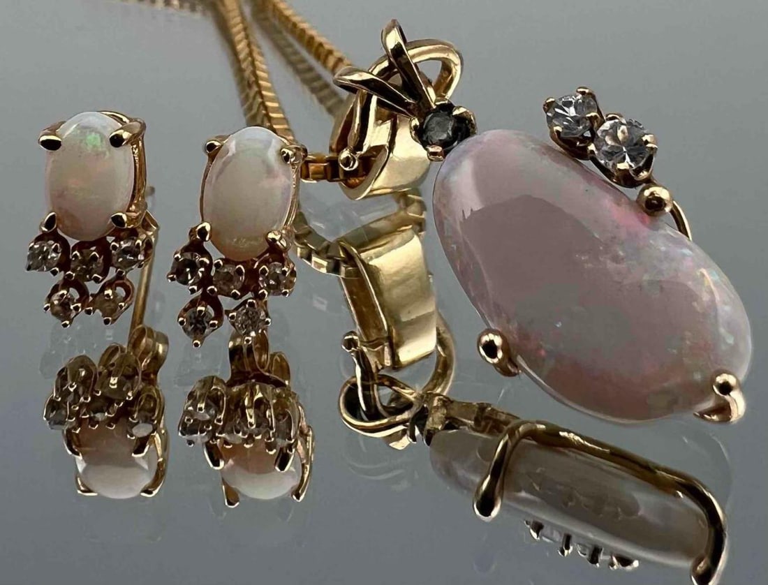 14K Opal White Sapphire Necklace & Earrings: 14K Opal White Sapphire Necklace & Earrings, 6.7g. Chain marked "Milor 14K Italy." Pendant marked 14K. Earring backs marked 14K. Pendant approximately 1.3125L x 0.4375W in. Opal approximately 16.0L x 
