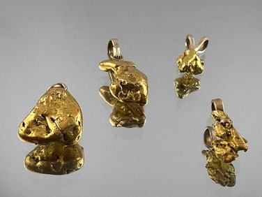 Four Gold Nugget Pendants