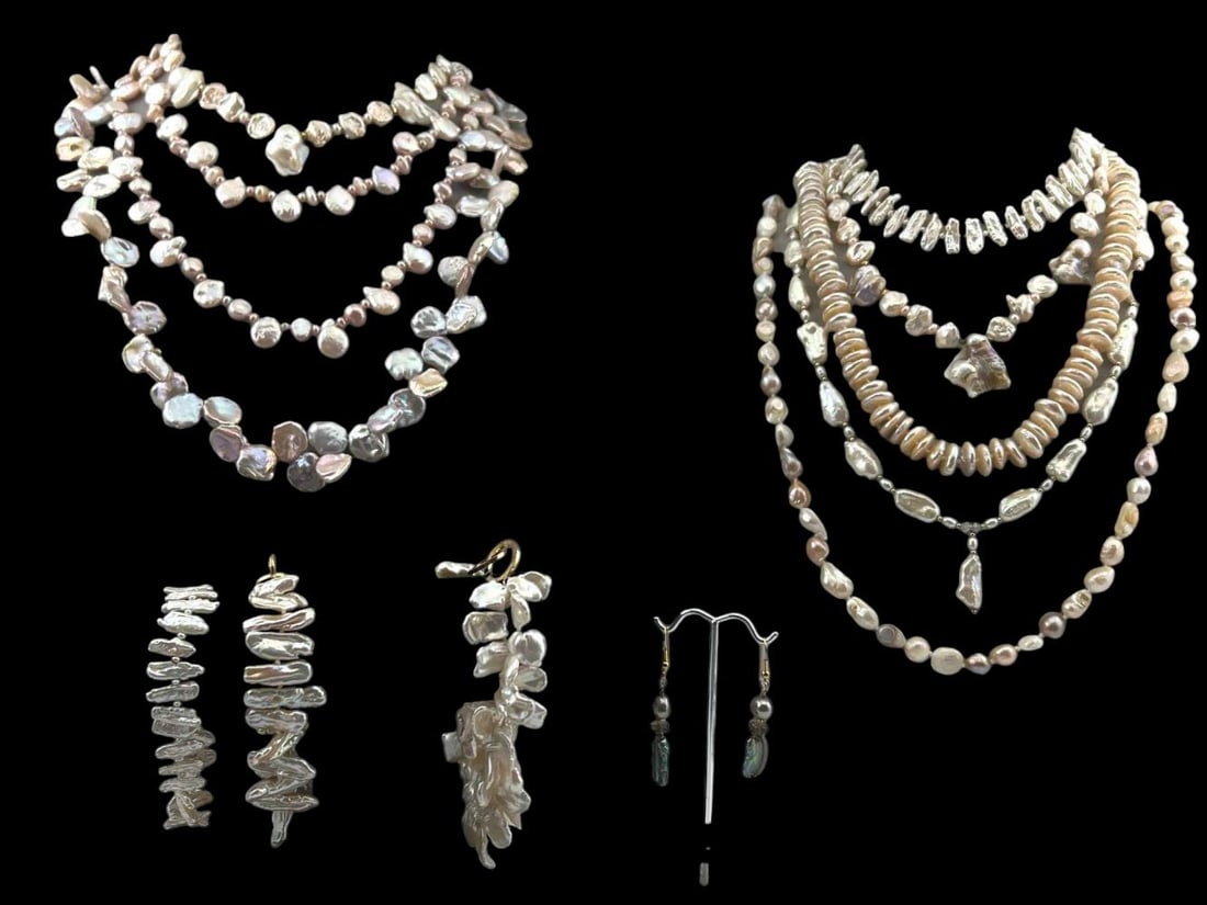 Lot Of Baroque Freshwater Pearl Jewelry: Lot Of Baroque Freshwater Pearl Jewelry. Includes nine necklaces, three bracelets, and earrings. Longest strand approximately 46.0in. Shortest strand (bracelet) approximately 6.75in. Earrings approxim