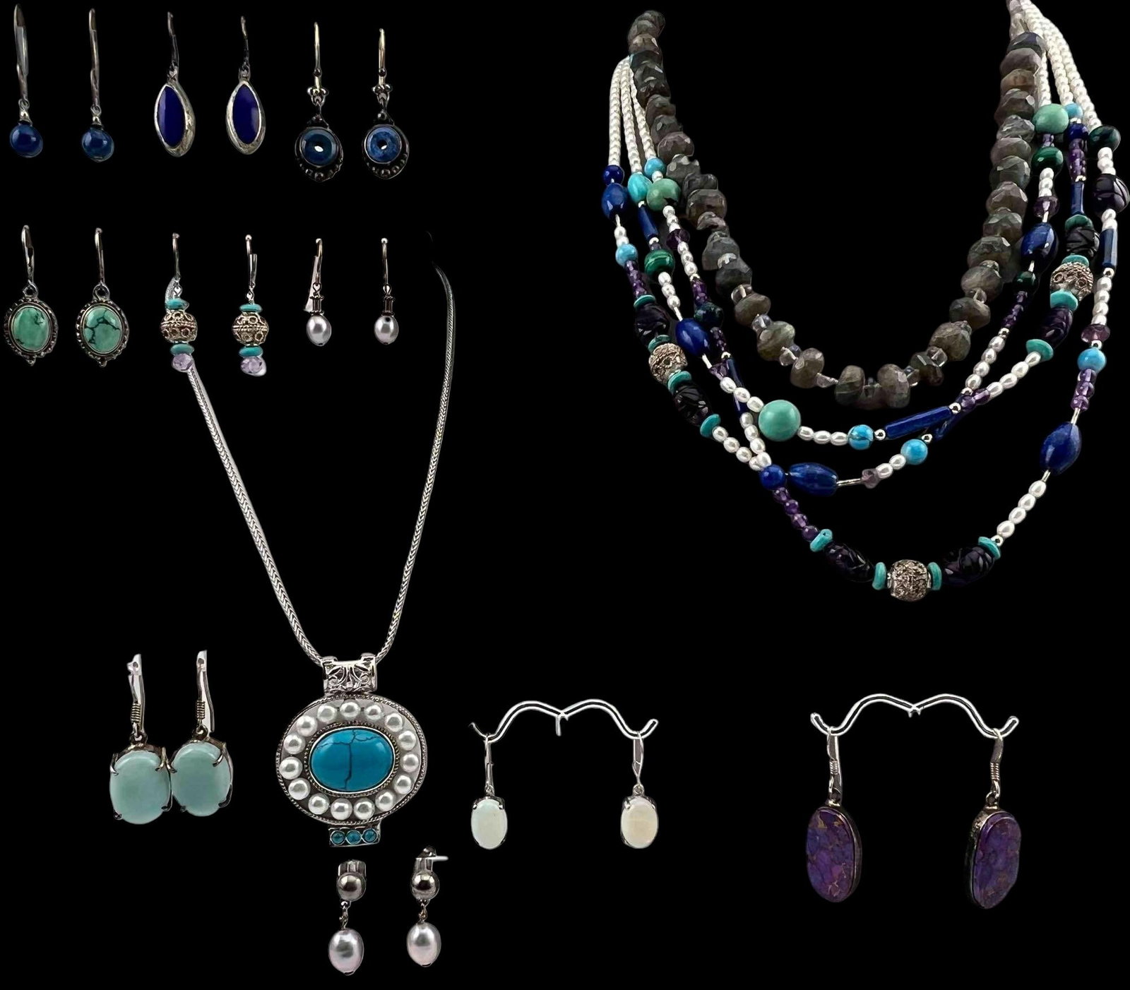 Lot Of Sterling Silver Semiprecious Stone Jewelry: Lot Of Sterling Silver Semiprecious Stone Jewelry, 178.8g. Includes Amethyst, pearls, lapis, opal, labradorite, and more. Pieces marked or test as sterling. Length of largest necklace approximately 23