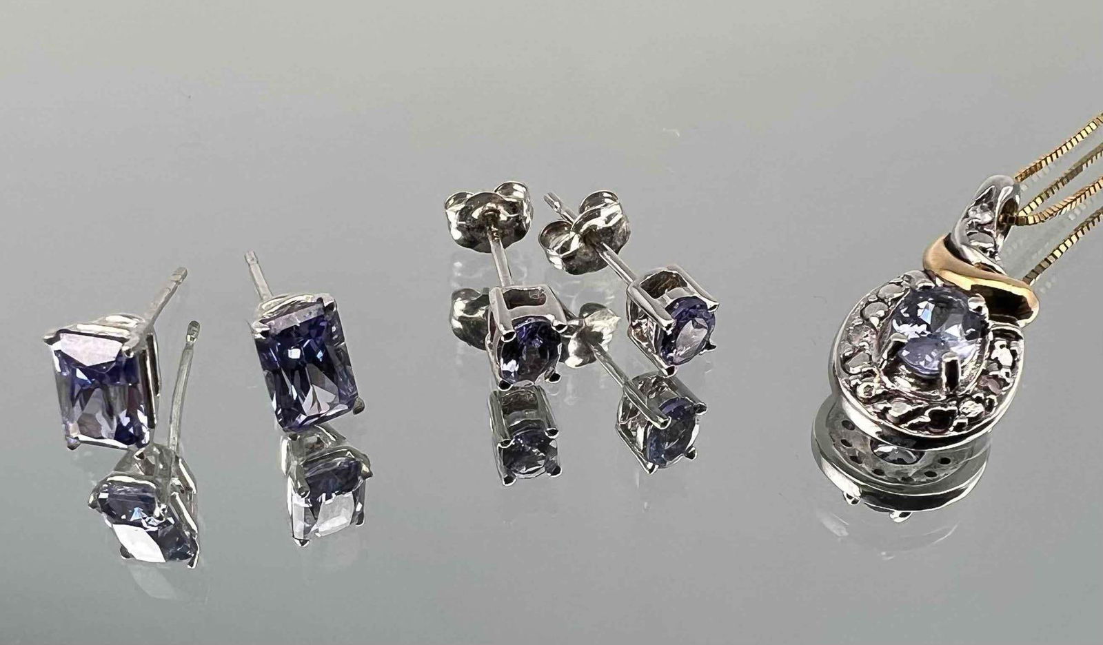 10K Tanzanite Necklace & Earrings: 10K Tanzanite Necklace & Earrings, 4.0g. Pendant approximately 17.6 x 8.5 mm. Chain length 20.0in. Earrings 3.9 x 2.9 mm and 5.9 x 3.8 mm. All measurements are approximate. ALL CREDIT CARDS WILL BE MA