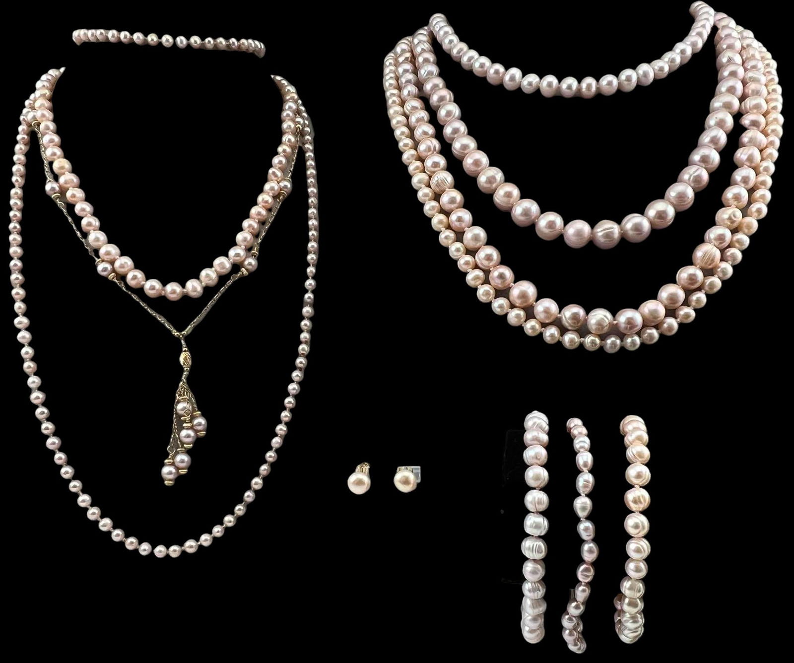 Lot Of Pink Freshwater Pearl Jewelry: Lot Of Pink Freshwater Pearl Jewelry. Longest strand approximately 34.0in. Bracelets approximately 7.75in. Largest pearls approximately 11.2mm.PLEASE NOTE THAT WINNING BIDDERS DO NOT NEED TO SELECT TH