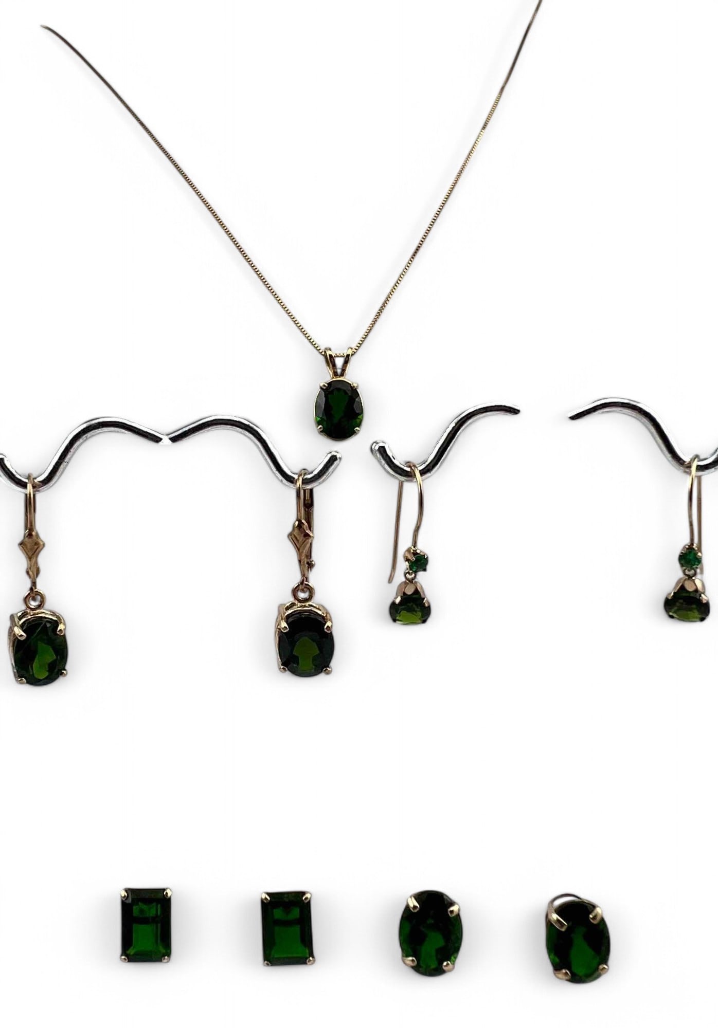 10K Chrome Diopside Earrings & Necklace: 10K Chrome Diopside Earrings & Necklace, 7.3g. Marked or test as 10K. Pendant 14.9 x 7.4mm (including bale). Chain length 20.0in. Largest earrings 1.0L x 0.28W in. Chrome diopside and tsavorite earrin
