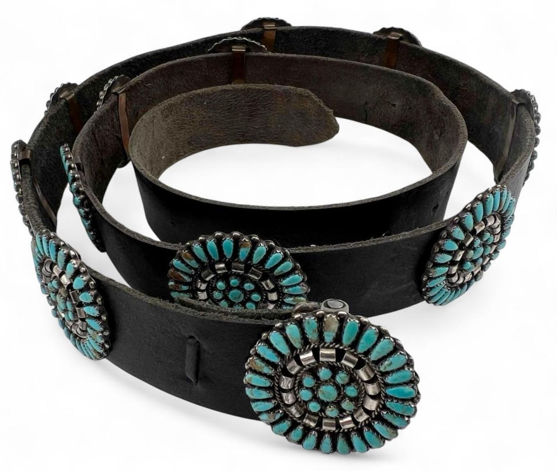Native American Sterling Silver Turquoise Concho Belt: Native American Sterling Silver Turquoise Concho Belt. Marked "Sterling." Signed "E.B." Silver conchos attached to belt with copper bracket. Conchos approximately 1.6in. Belt length approximately 37.7