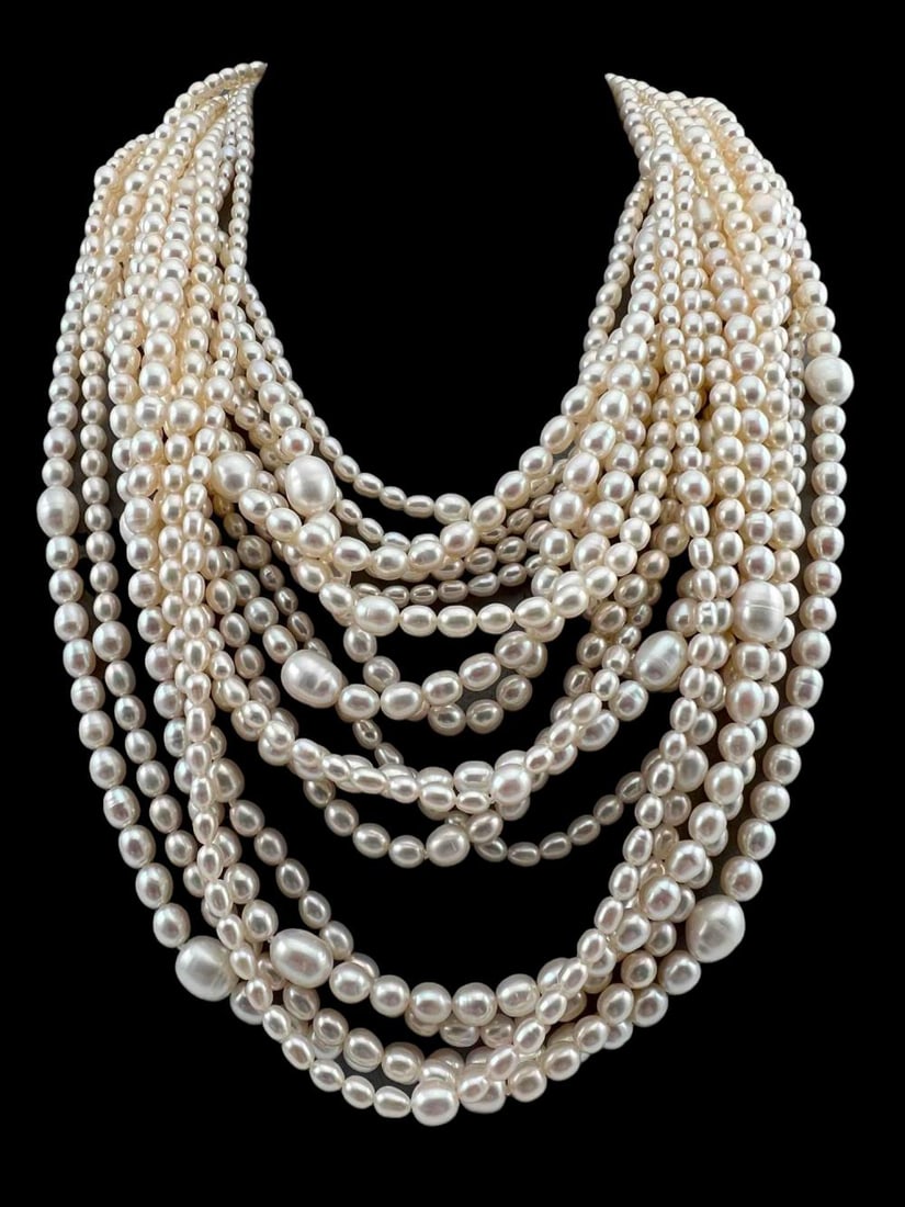 18 Strand Sterling Silver Freshwater Pearl Necklace: 18 Strand Sterling Silver Freshwater Pearl Necklace. Clasp marked 925. Length approximately 20.0in. Largest pearls approximately 11.7 x 9.3 mm.